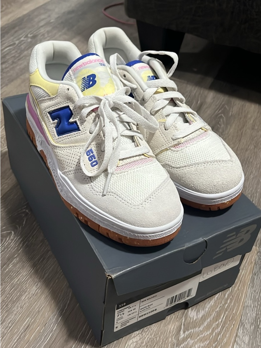 New Balance womens 550 Casual Sneakers in Cream with Blue Accent